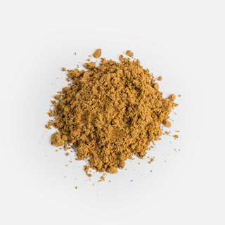 Close-up of the golden powder from Herbaly's Detox Liver Restore Complete Capsules showing its fine texture