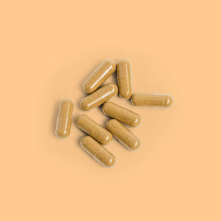 Close-up of Herbaly's Detox Liver Restore Complete Capsules showing their size, shape, and color